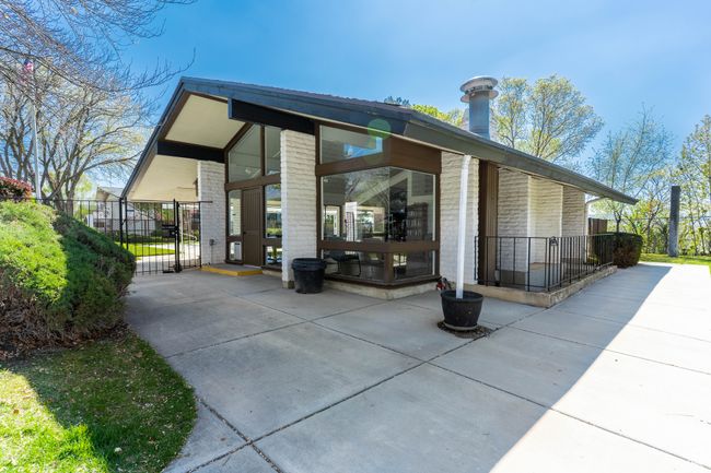 Exterior space featuring fence, a gate, and brick siding | Image 32
