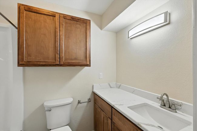 Bathroom with toilet and vanity | Image 10