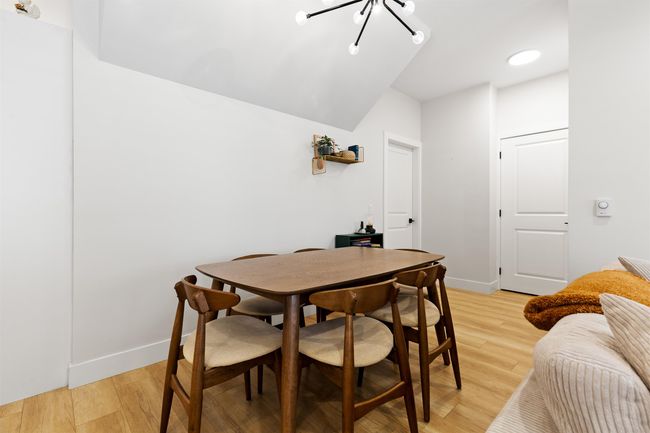 Dining space featuring baseboards, recessed lighting, an inviting chandelier, and light wood-style floors | Image 11