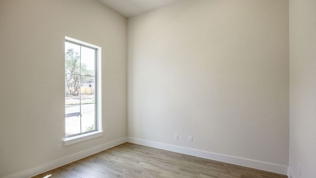 Unfurnished room with healthy amount of natural light, light wood-type flooring, and baseboards | Image 10