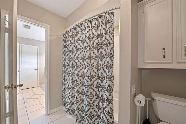Busy mornings are a breeze with the tub/shower area separated from the vanity area. | Image 29