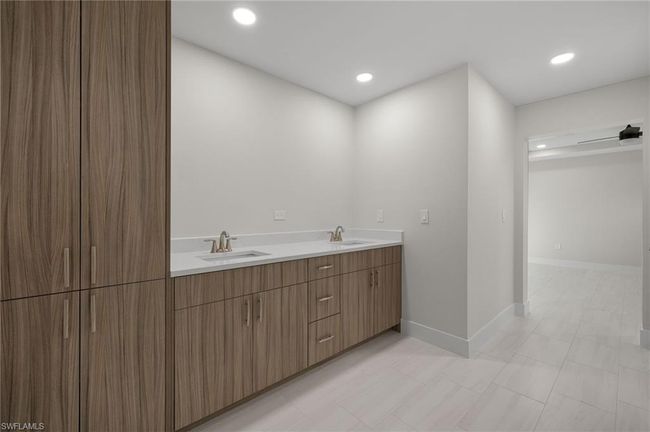 Bathroom with dual vanity and tile patterned flooring | Image 26