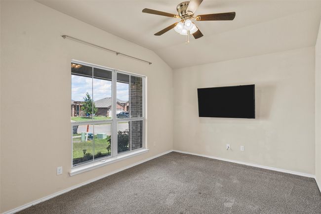 Unfurnished room with vaulted ceiling, carpet floors, and ceiling fan | Image 7