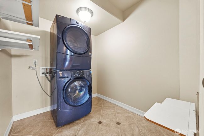 Good sized utility room with extra storage space. | Image 24