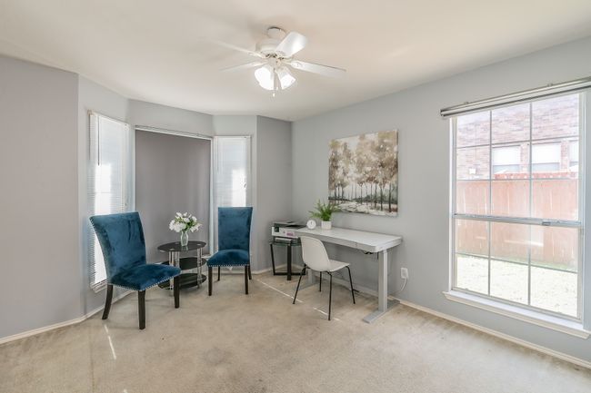 Office featuring light colored carpet, plenty of natural light, and ceiling fan | Image 8
