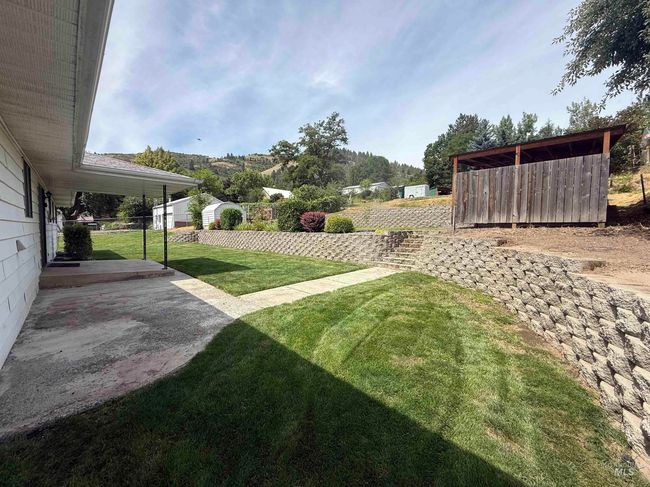 View of green lawn with an outdoor structure | Image 11