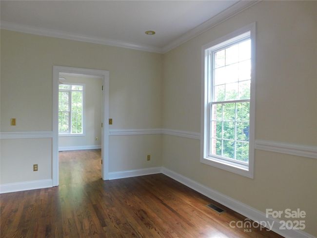 Part of the primary suite, picture a private sitting room, library, or office. | Image 22