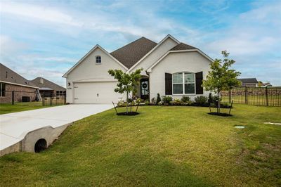 View of front facade featuring a garage and a front lawn | Image 2