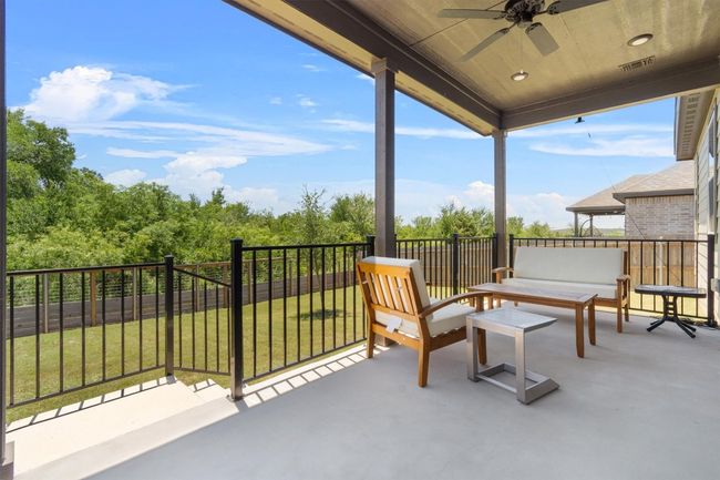 View of patio / terrace featuring ceiling fan and an outdoor living space | Image 9