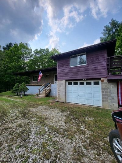 View of front of house with a garage | Image 2