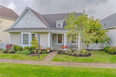 View of front of property featuring a front lawn and a porch | Image 1