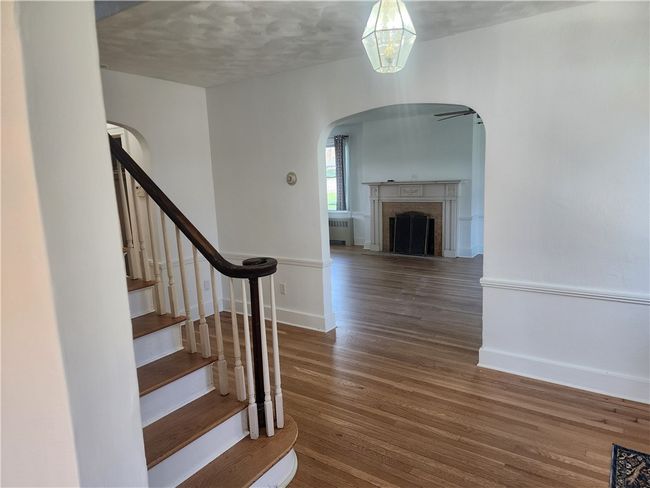 View from dining room thru entry and into living room. | Image 8