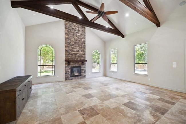 Huge Valted Beamed Ceiling Living Room With Stacked Stone Fire Place | Image 17
