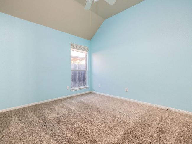 Two bedrooms are located off the media room, and are similar in size. | Image 14