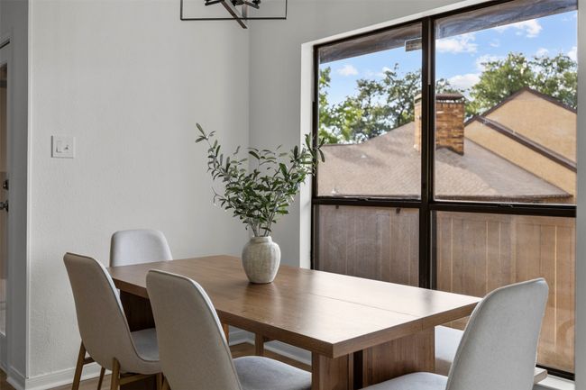 Dining room featuring a chandelier | Image 5