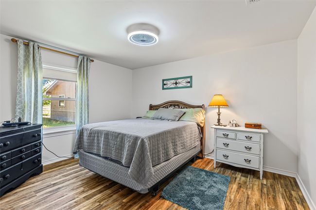 Bedroom featuring wood finished floors | Image 18