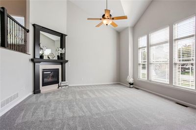 Stunning Great Room with New Carpet, Vaulted Ceilings and Natural Light | Image 3