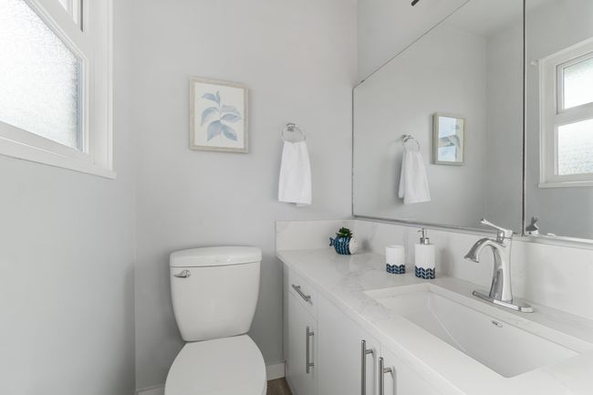Bathroom with toilet and vanity | Image 14