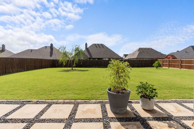 View of fenced backyard | Image 25