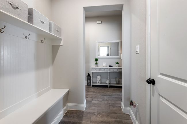 Mudroom featuring baseboards and dark wood-type flooring | Image 10