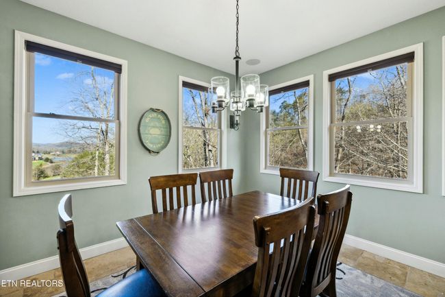 Multiple windows offering natural light and the enjoyment of the natural surroundings. | Image 19
