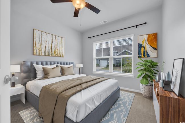 Carpeted bedroom featuring baseboards, visible vents, and ceiling fan | Image 12