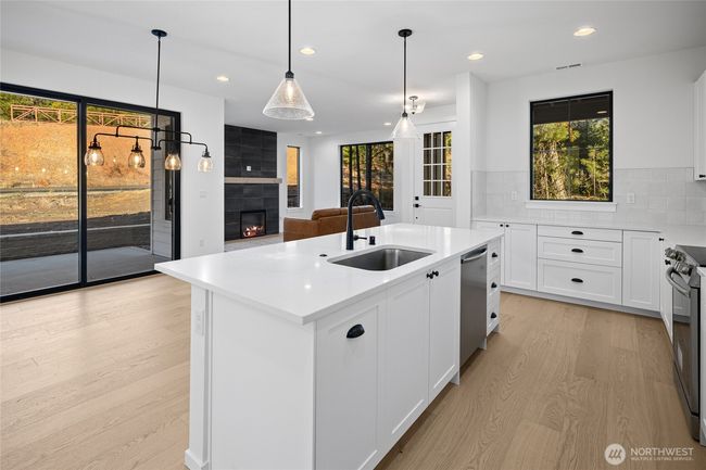 As the newest PNW master-planned community, enjoy 200+ acres of open space, trails & the Coal Trax Mt Bike Park. Soaring ceilings in the great roommake each day worthy of celebration & open floorplan appeals to entertaining. Covered deck & patio. Southern-facing homesites range from the mid600s- 900ks. Enjoy a variety of innovative & distinctive new home options with the best all-season recreation just moments away! Built for the future, indulge in a retreat just 90-min to Seattle. Plans and elevations are artist’s renderings only, may not accurately represent the actual condition of a home asconstructed and may also contain options and upgrades which are not included in the sale. Trailside Homes reserves the right to make changes to the floorplan, specifications, dimensions, design and elevations without prior notice. Stated dimensions and square footage are estimated and should not be usedas representations of the home’s actual size. | Image 21