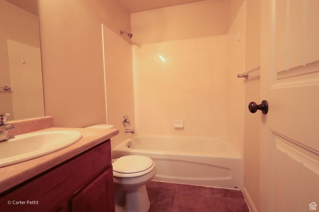 Full bath with vanity, bathing tub / shower combination, and tile patterned flooring | Image 11