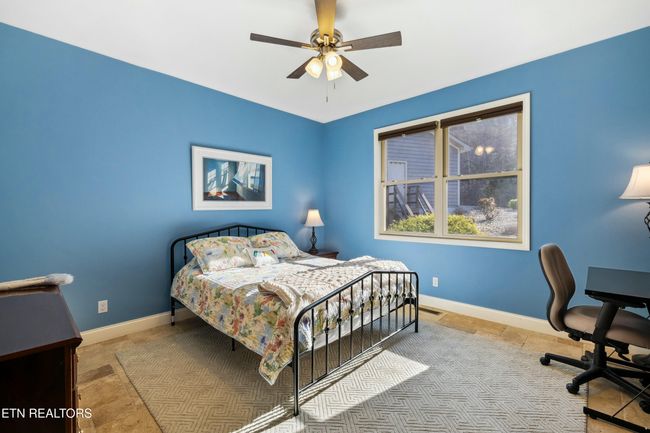 Main Level Guest Room with large closets and plenty of space for various furniture options. | Image 32