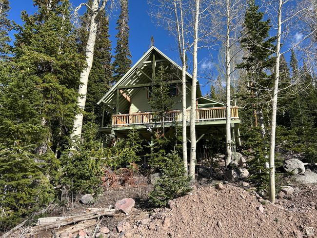 View of side of home featuring a wooden deck | Image 47