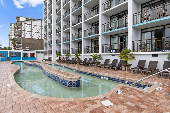 Community pool featuring a patio area | Image 27