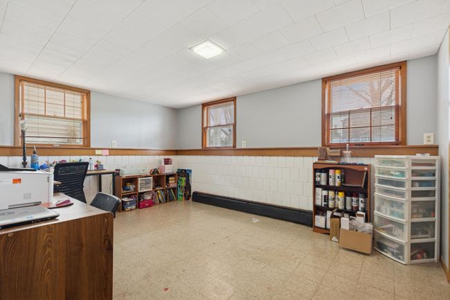The third bedroom on the lower level is currently being used as a craft room. | Image 15