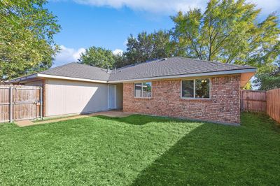 Rear view of house featuring a lawn | Image 2