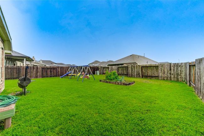 Large fully fenced back yard with plenty of room for a garden or a pool! | Image 38