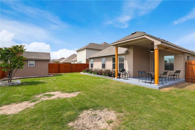 Back of property with a ceiling fan and a patio area | Image 21