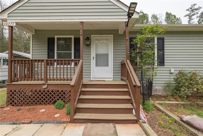 View of exterior entry with covered porch | Image 33