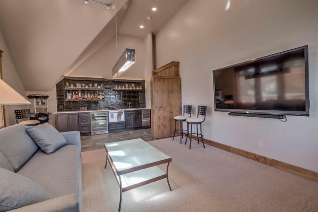 Play some games, or catch THE game, in this fun family room-complete with wet bar. | Image 23