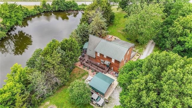 Aerial view of property and surrounding area featuring a nearby body of water | Image 71