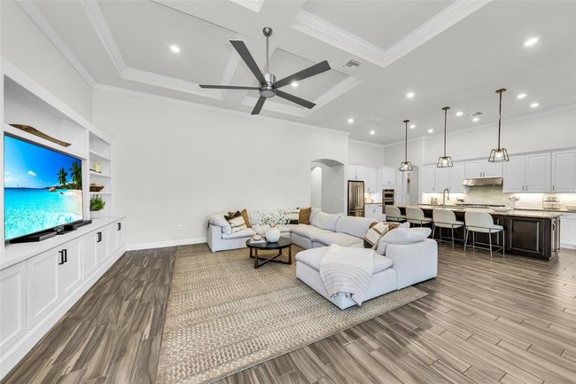 coming in form the hallway it opens to living room, kitchen and dining room | Image 16
