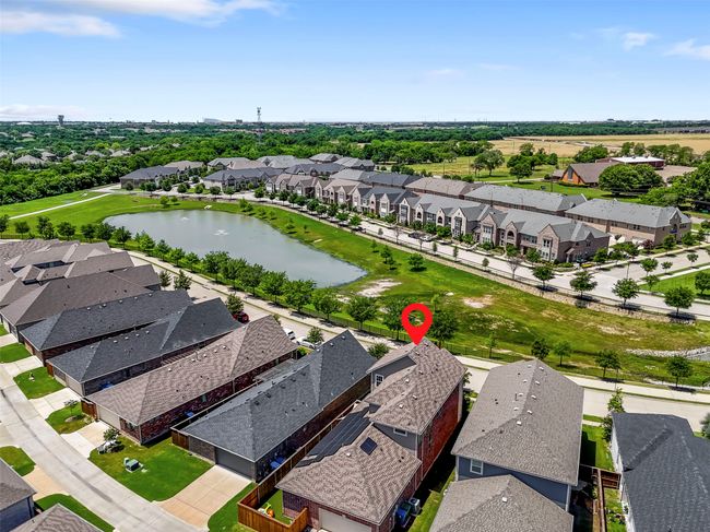 Aerial view of residential area with a large body of water | Image 40