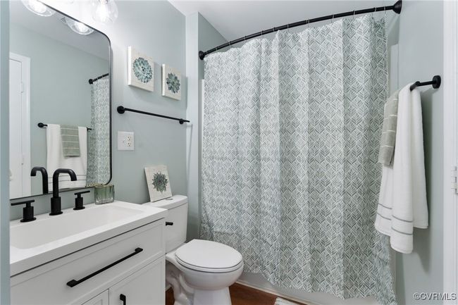 Full bathroom featuring vanity and a shower with curtain | Image 9