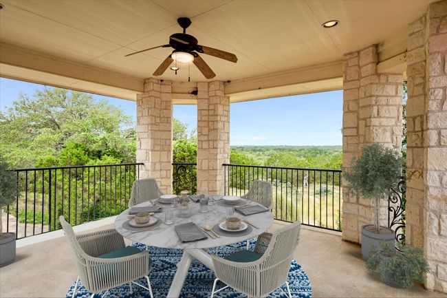 The patio is just outside the Library. It overlooks the back Pond, Field and Forest. This will change your perspective of living in a community and enjoying a forever view! Truly, peaceful and quiet. | Image 22