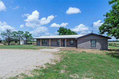 Ranch-style house with a front yard | Image 2