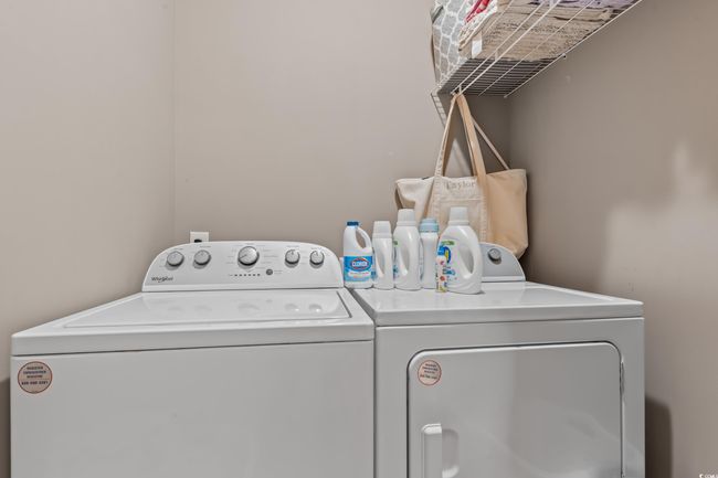 Laundry area with washer and clothes dryer | Image 36
