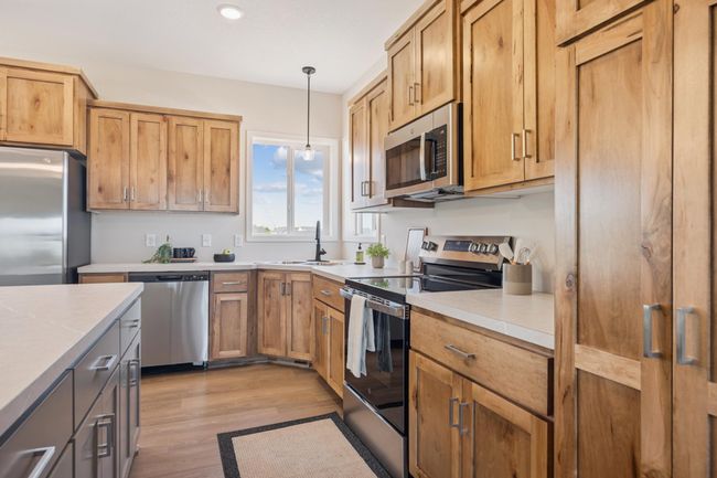 Corner sink positioned between two windows for abundant natural light! | Image 10