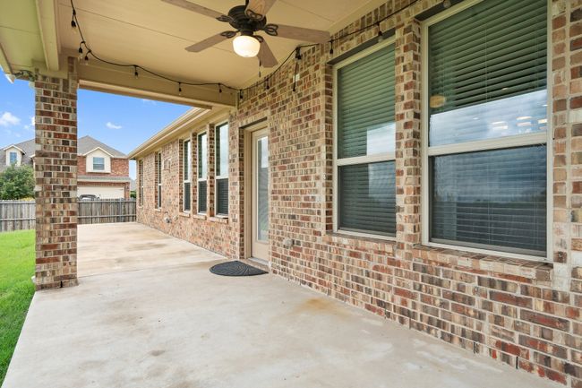View of patio with ceiling fan | Image 28