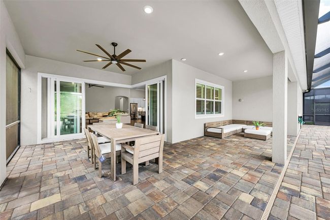patio dining and sitting area in lanai | Image 56