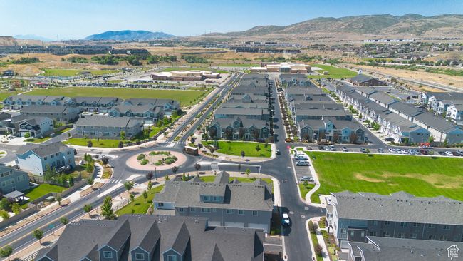 Aerial view of property's location with a mountain backdrop and nearby suburban area | Image 39