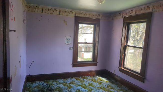 Empty room featuring baseboards | Image 9