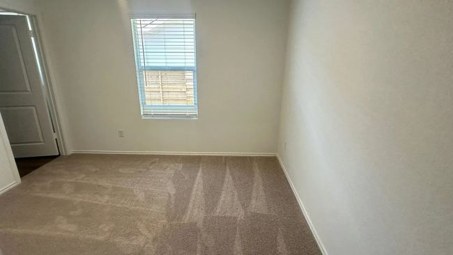 Carpeted empty room featuring baseboards | Image 13